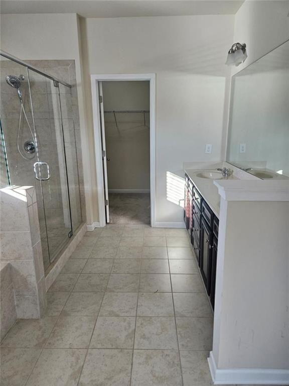 90 Partridge Drive Covington, GA 30016 - Photo 26 of 38 a bathroom with a granite countertop sink a large mirror and a shower