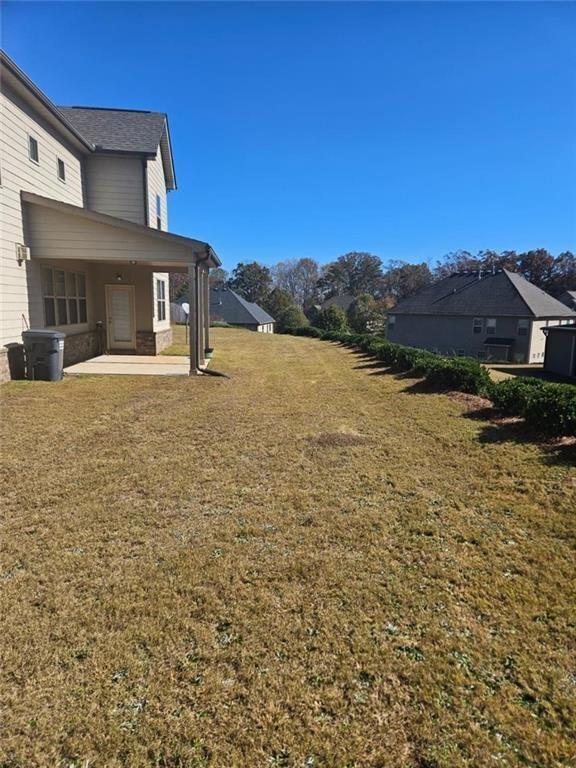 90 Partridge Drive Covington, GA 30016 - Photo 28 of 38 a front view of a house with a yard