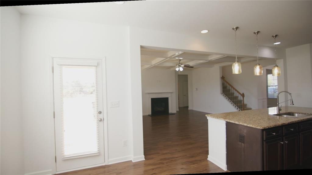 90 Partridge Drive Covington, GA 30016 - Photo 32 of 38 a view of a hallway with front door and wooden floor