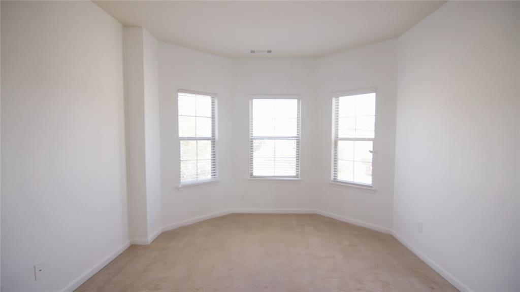 90 Partridge Drive Covington, GA 30016 - Photo 33 of 38 an empty room with windows