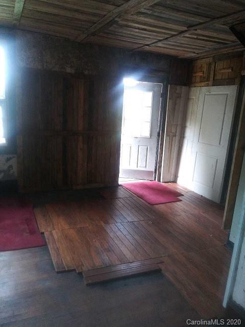 1995 Flat Creek Road Lancaster, SC 29720 - Photo 8 of 16 a view of an empty room with wooden floor and a window