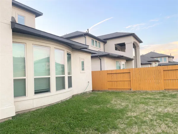 a view of a brick house with a large windows