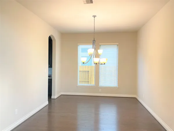 a living room with furniture fireplace and a large window