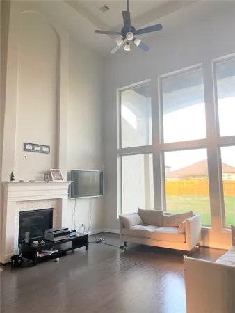 a view of a room with furniture and windows