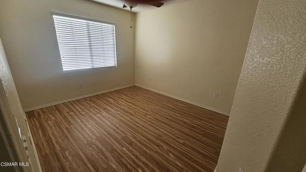 1706 Blazewood Street Simi Valley, CA 93063 - Photo 6 of 13 a view of an empty room with wooden floor and a window