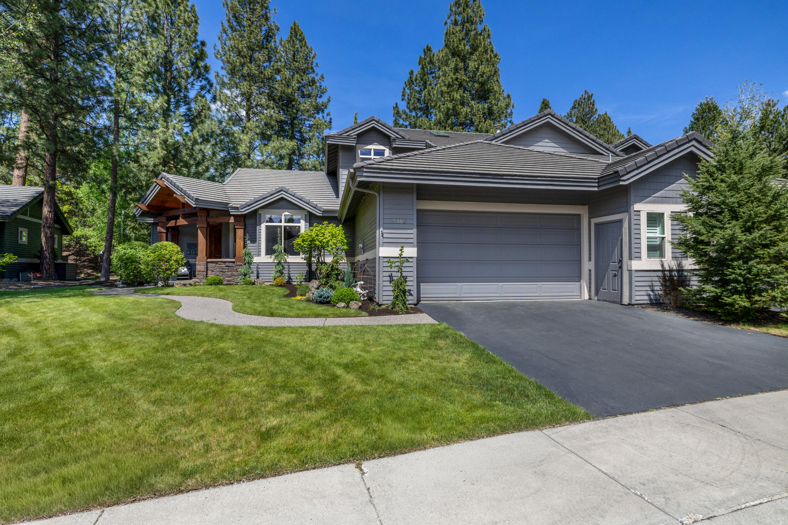 19460 Chip Shot Lane Bend, OR 97702 - Photo 49 of 56 a front view of a house with garden
