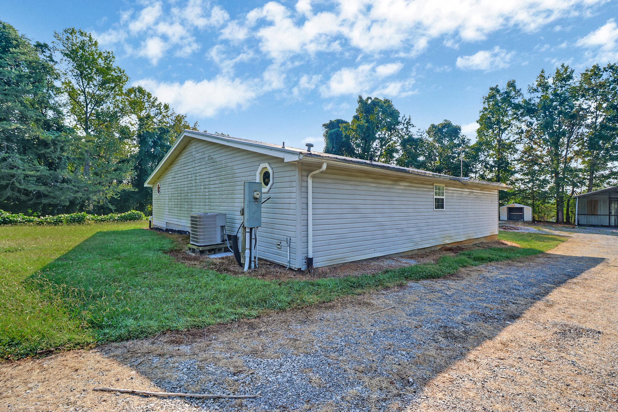 3702 Toestring Valley Road Spring City, TN 37381 - Photo 13 of 28 a view of a house with backyard and garden