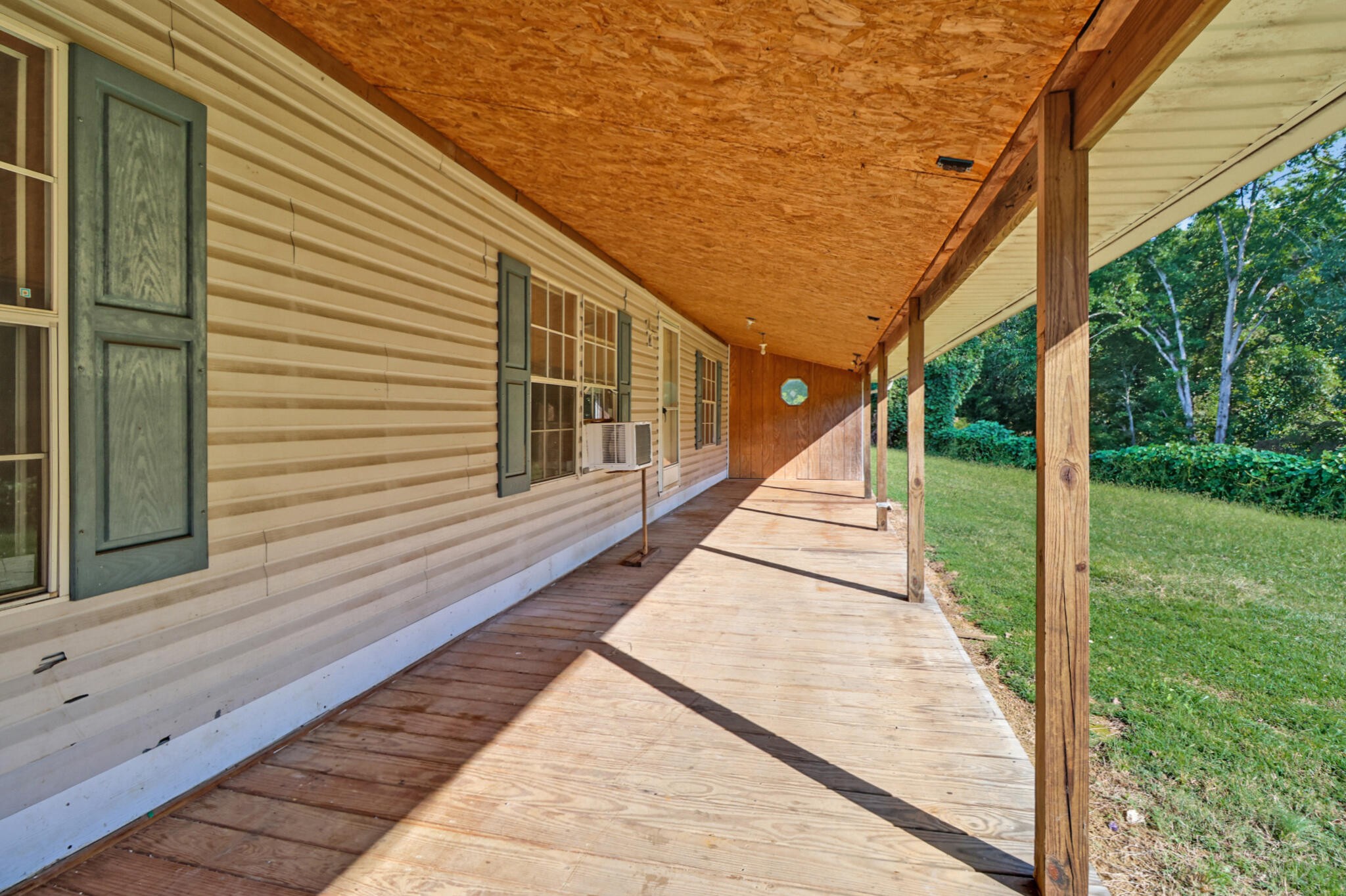 3702 Toestring Valley Road Spring City, TN 37381 - Photo 14 of 28 a view of a balcony with wooden floor and fence