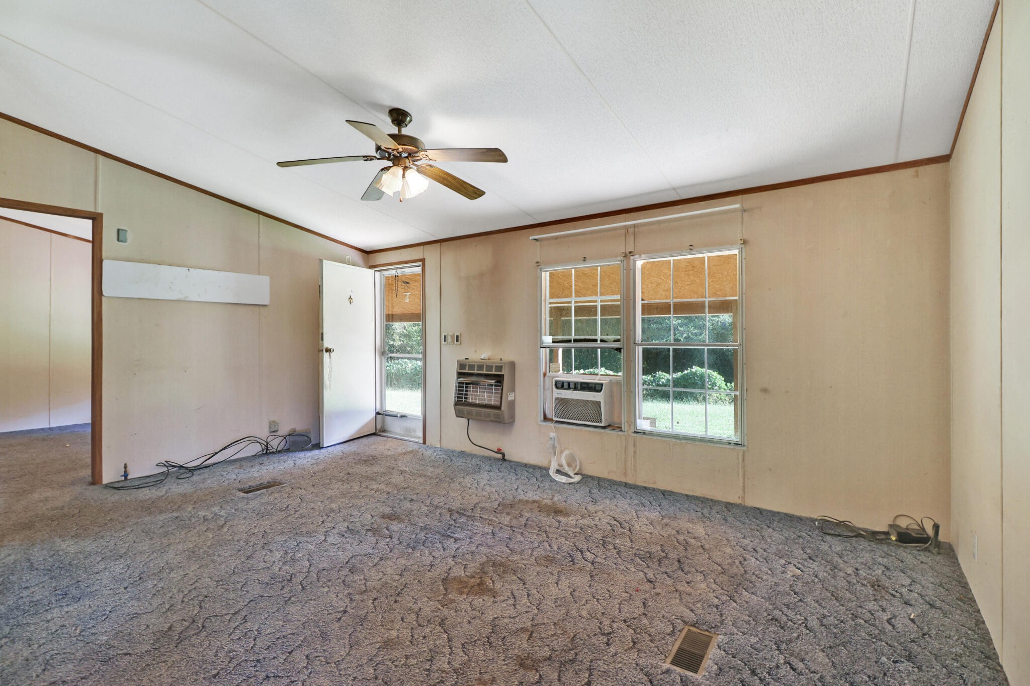 3702 Toestring Valley Road Spring City, TN 37381 - Photo 16 of 28 a view of a livingroom with a ceiling fan and window