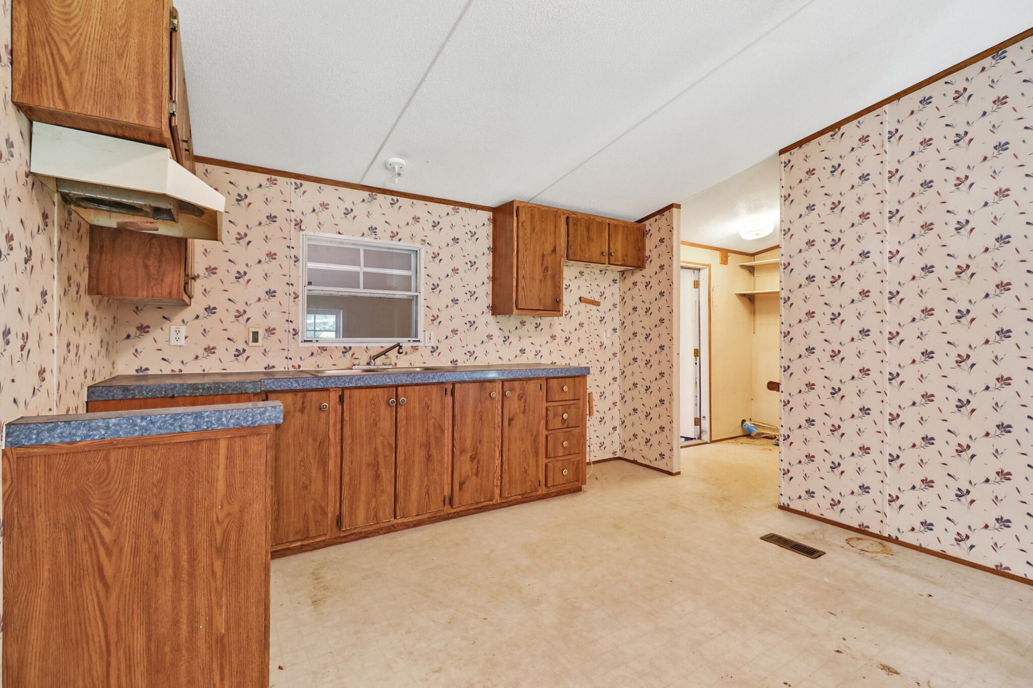 3702 Toestring Valley Road Spring City, TN 37381 - Photo 17 of 28 a bathroom with a granite countertop sink a mirror and shower