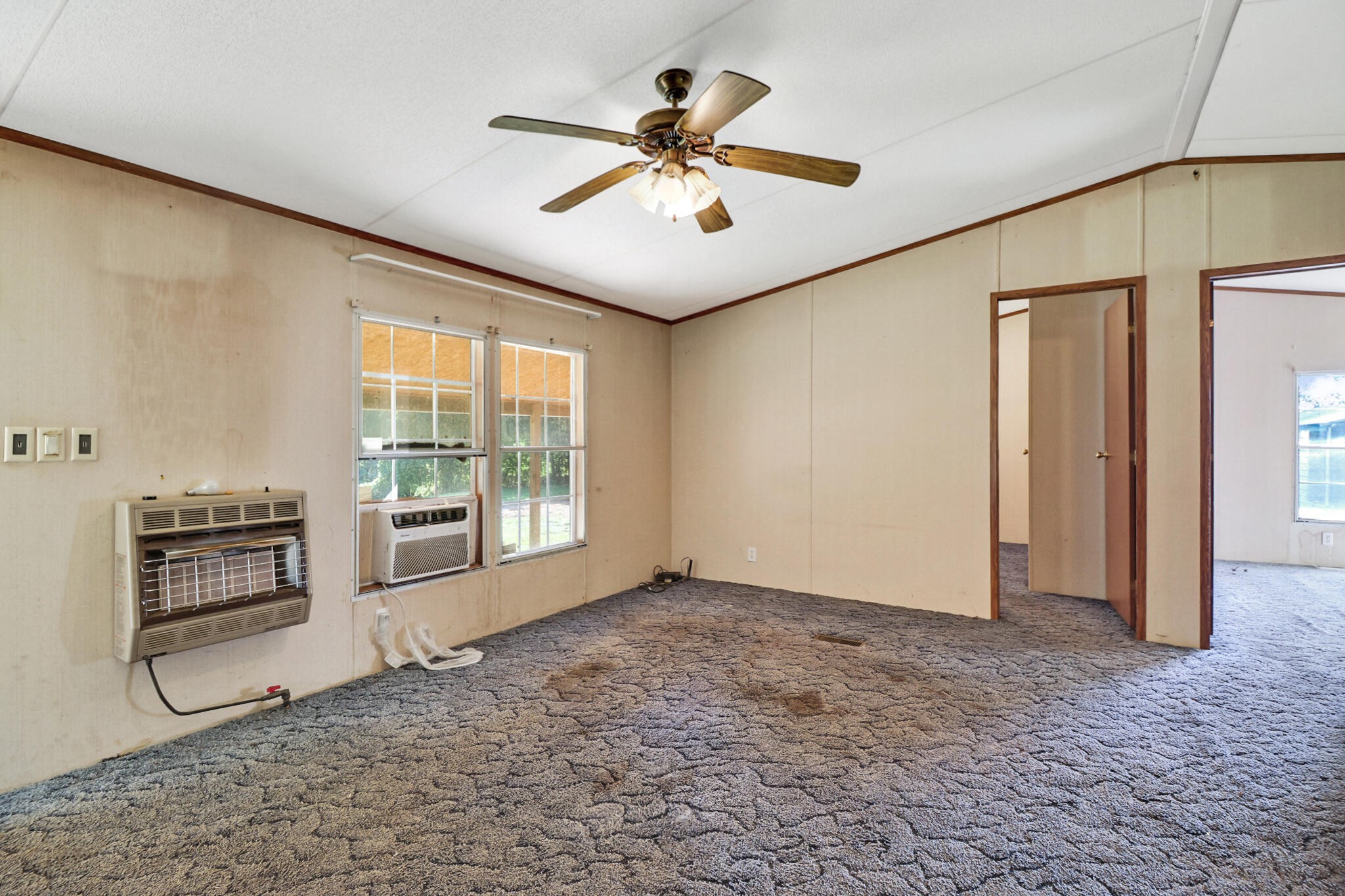 3702 Toestring Valley Road Spring City, TN 37381 - Photo 25 of 28 a view of a livingroom with a ceiling fan and window