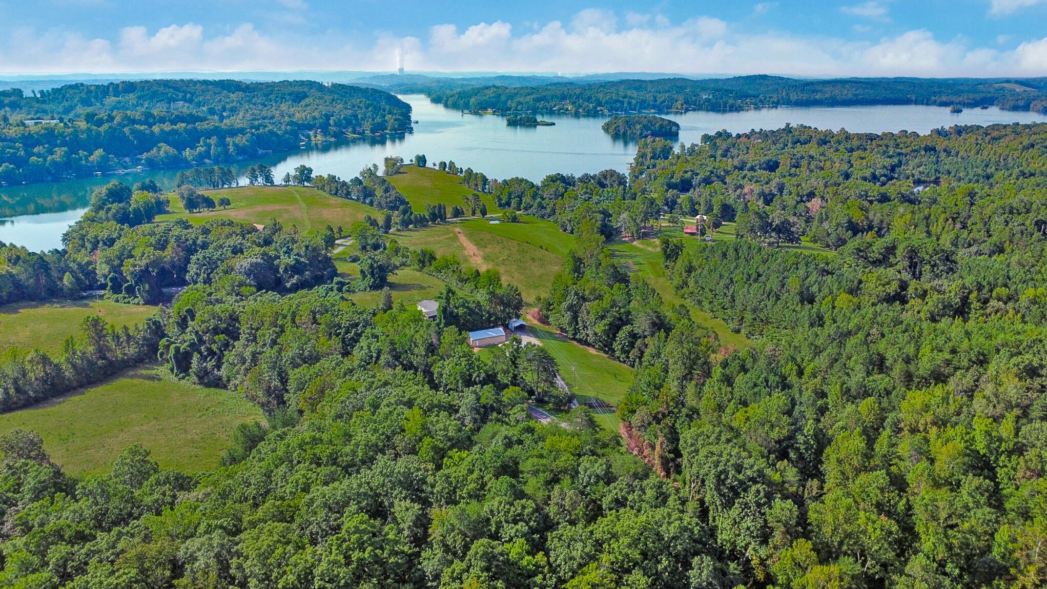 3702 Toestring Valley Road Spring City, TN 37381 - Photo 7 of 28 a view of a lake with a building in the background