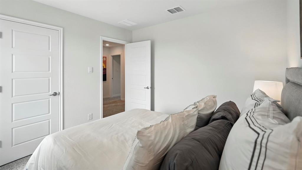 2640 Gladewater Road Celina, TX 75009 - Photo 14 of 40 a bed sitting in a bedroom and closet