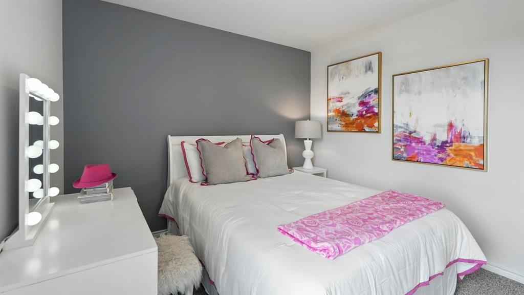 2640 Gladewater Road Celina, TX 75009 - Photo 16 of 40 a bedroom with bed and wall painting
