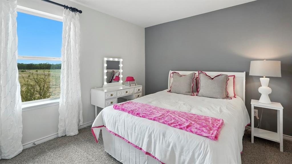 2640 Gladewater Road Celina, TX 75009 - Photo 17 of 40 a bedroom with a bed and a window