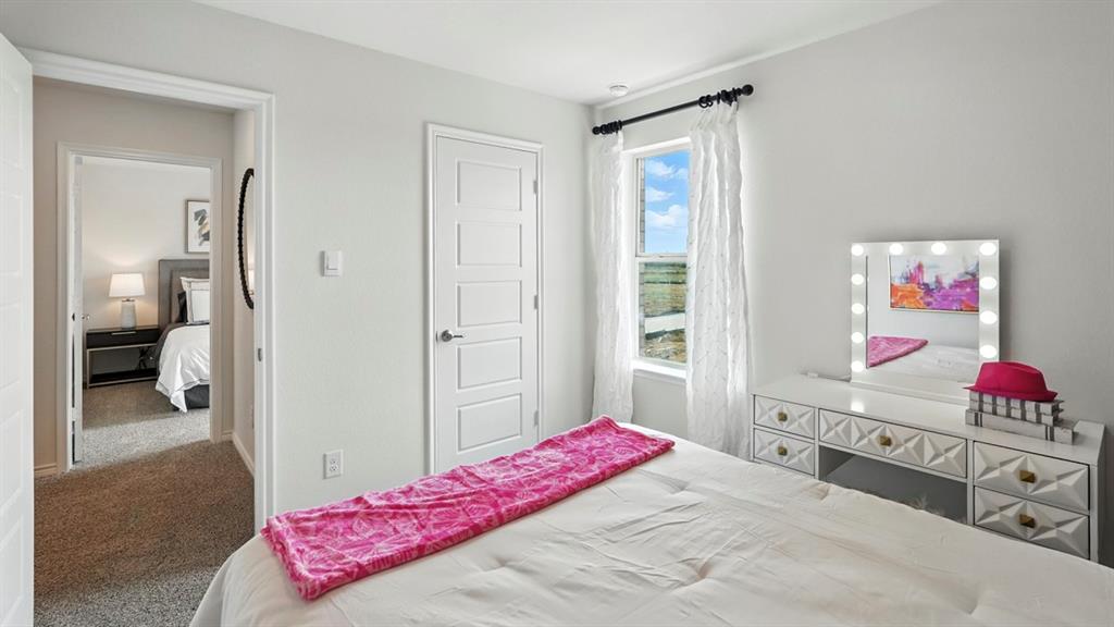 2640 Gladewater Road Celina, TX 75009 - Photo 18 of 40 a bedroom with a bed and a view of bedroom