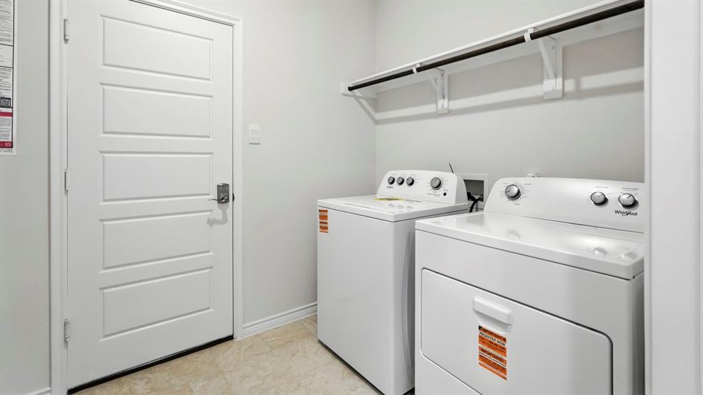 2640 Gladewater Road Celina, TX 75009 - Photo 35 of 40 a utility room with dryer and washer