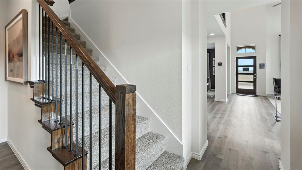 2640 Gladewater Road Celina, TX 75009 - Photo 40 of 40 a view of a hallway with wooden floor and staircase