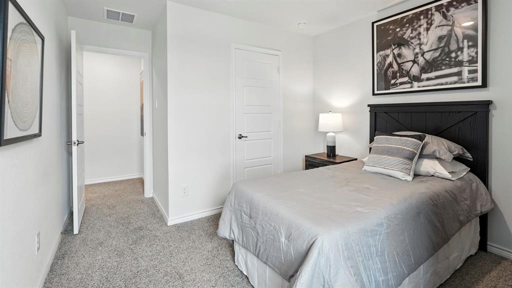 2640 Gladewater Road Celina, TX 75009 - Photo 9 of 40 a bedroom with bed and wall painting