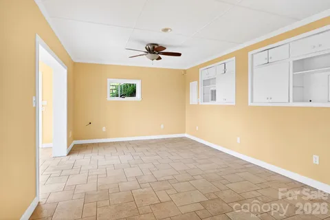 a view of an empty room with a window