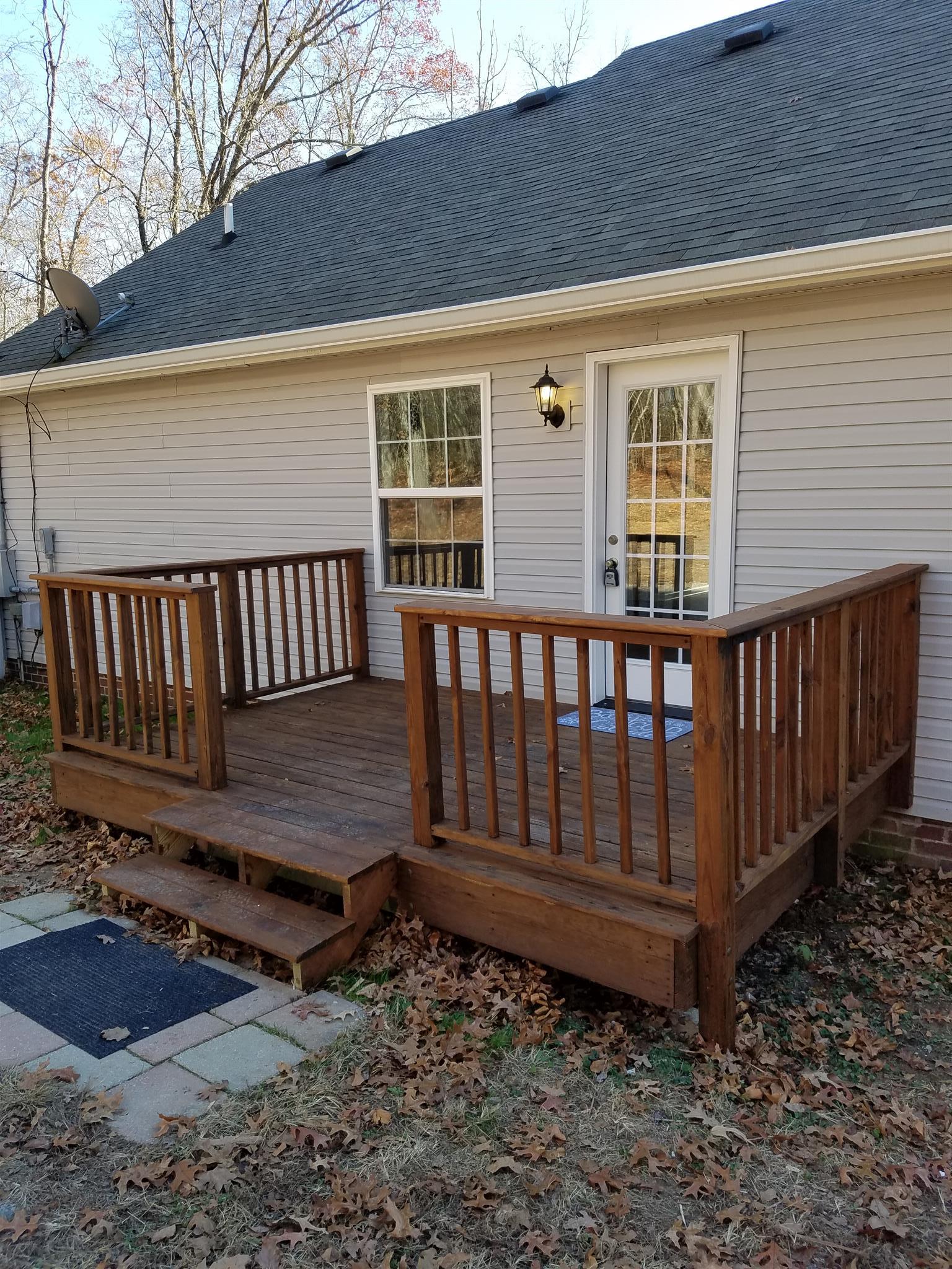 1300 Glendale Road Dickson, TN 37055 - Photo 13 of 30 a view of a wooden bench in the backyard
