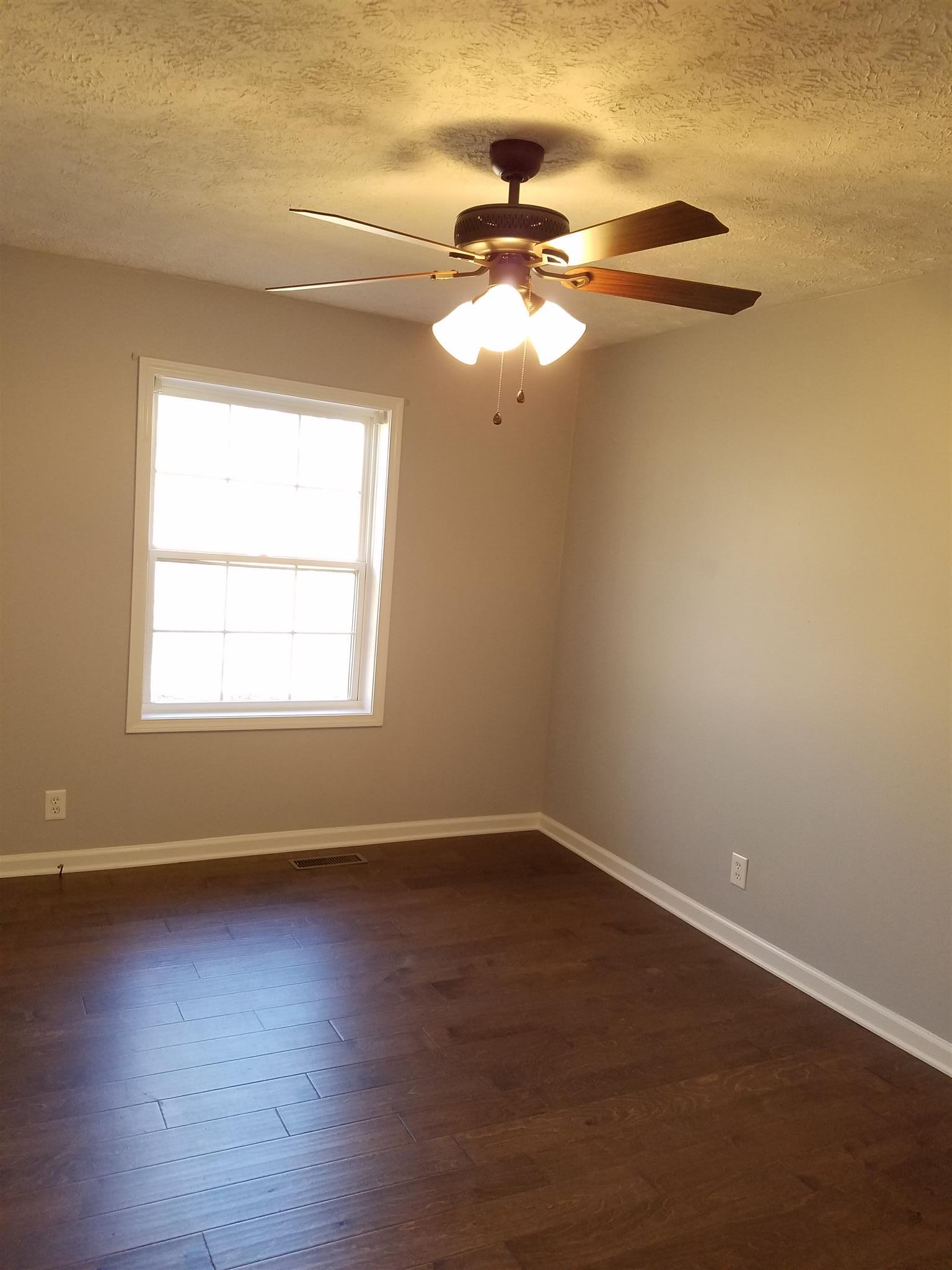 1300 Glendale Road Dickson, TN 37055 - Photo 23 of 30 a view of a room with wooden floor fan and window