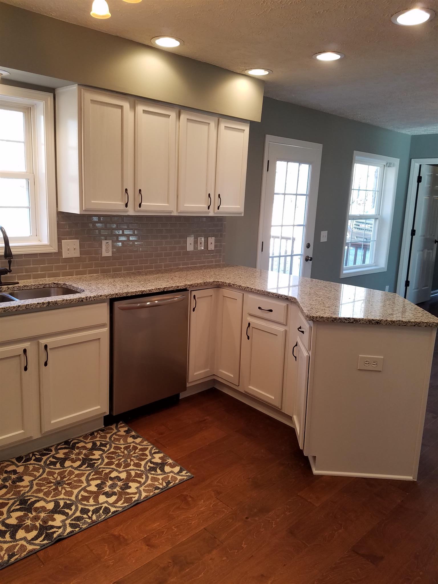 1300 Glendale Road Dickson, TN 37055 - Photo 5 of 30 a kitchen with sink and cabinets