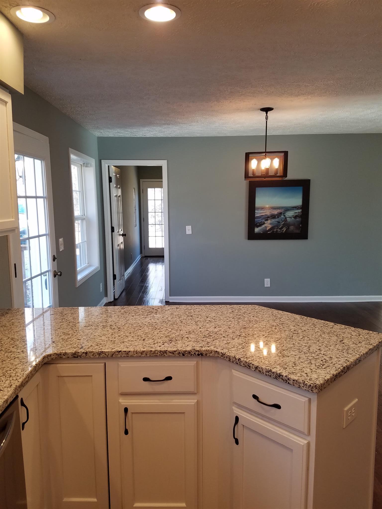 1300 Glendale Road Dickson, TN 37055 - Photo 7 of 30 a view of a kitchen counter space and wooden floor