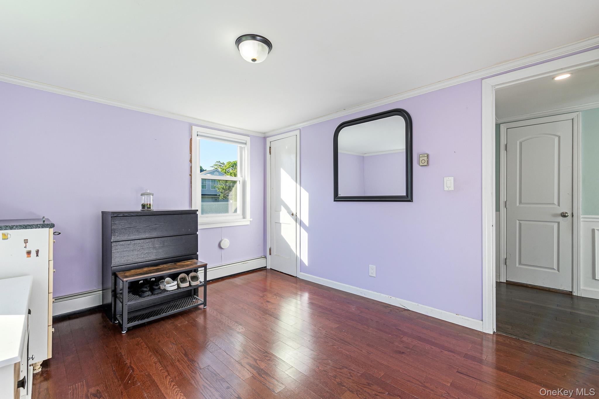 33 Lillian Road Nesconset, NY 11767 - Photo 19 of 42 The Second Guest Bedroom Is Well Sized With A Large Double Sized Window & Second Window For Natural Light, Hardwood Floors, Good Sized Closet & Ample Room For Furniture.