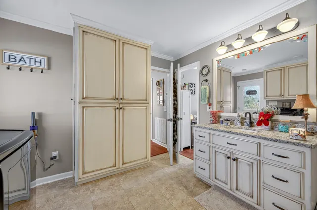a view of a hallway with closet and cabinet