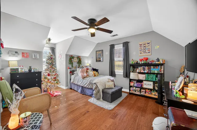 a bed room with bed and a window