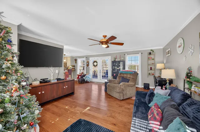 a living room with furniture and a flat screen tv