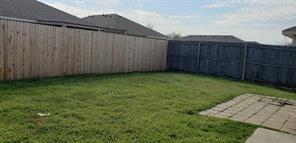 9004 Quarry Ridge Trail Fort Worth, TX 76244 - Photo 3 of 11 a view of a backyard with wooden fence