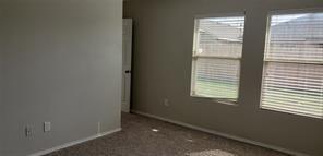 9004 Quarry Ridge Trail Fort Worth, TX 76244 - Photo 4 of 11 a view of an empty room with a window