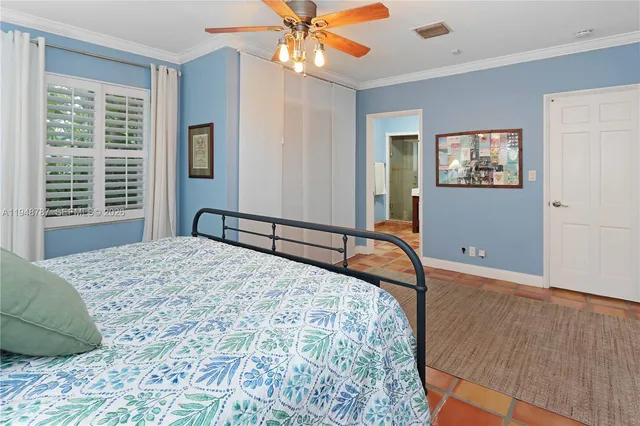 a view of a livingroom with wooden floor and a fireplace