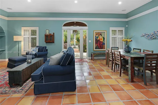 a living room with furniture and a rug