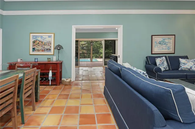 a dining room with furniture and window