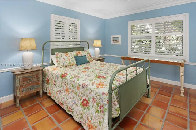 a bedroom with a bed and a sink