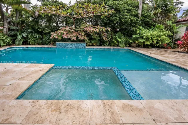 a view of a house with a potted plant and a window