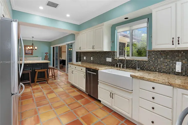 a room with washing machine and window