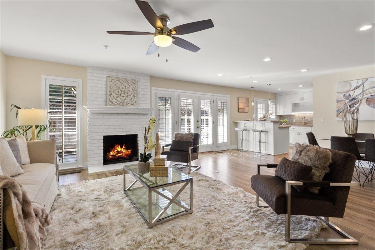 654 North San Antonio Road Los Altos, CA 94022 - Photo 1 of 28 a living room with furniture and a fireplace