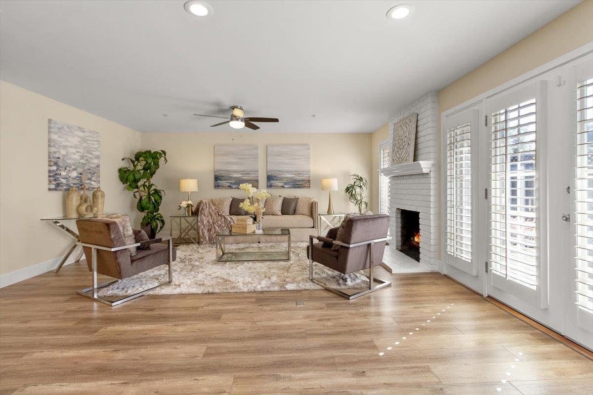 654 North San Antonio Road Los Altos, CA 94022 - Photo 16 of 28 a living room with furniture a fireplace and a table