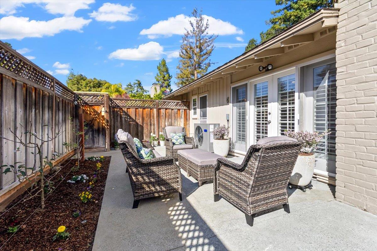 654 North San Antonio Road Los Altos, CA 94022 - Photo 25 of 28 a view of a patio with couches table and chairs and potted plants