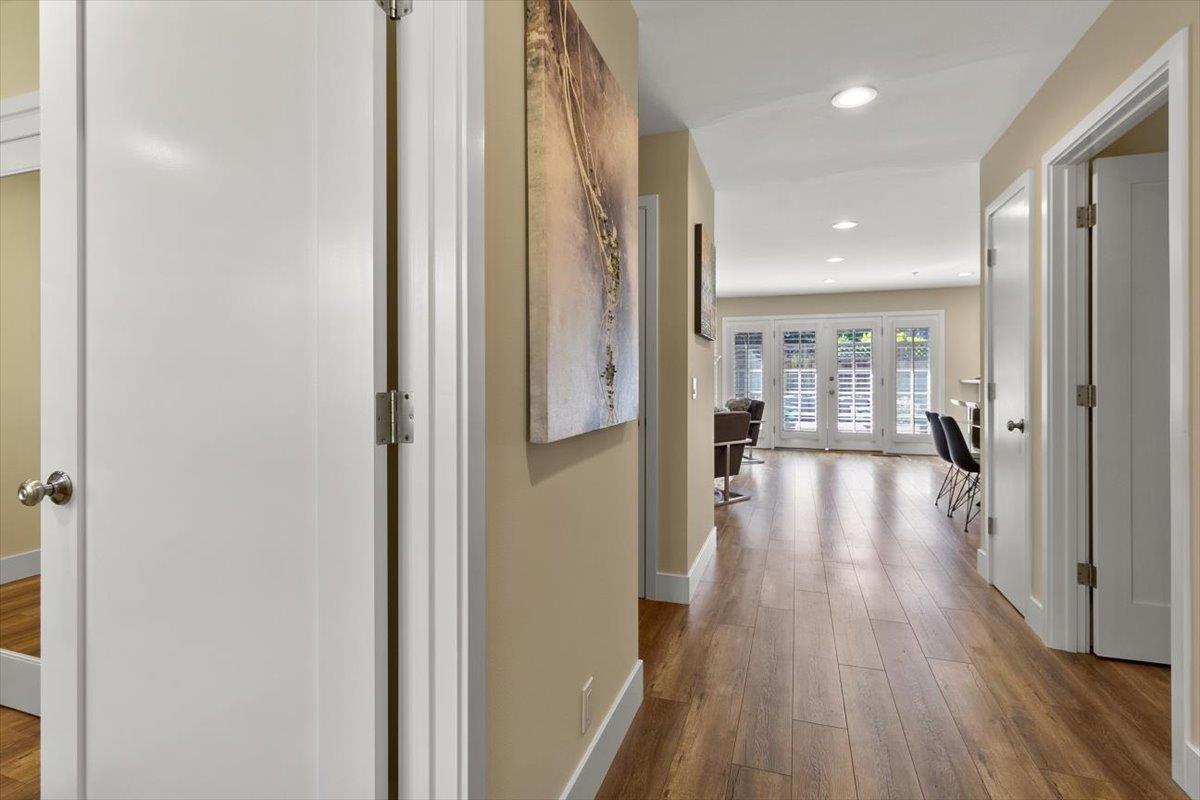 654 North San Antonio Road Los Altos, CA 94022 - Photo 3 of 28 a view of a hallway with wooden floor and furniture