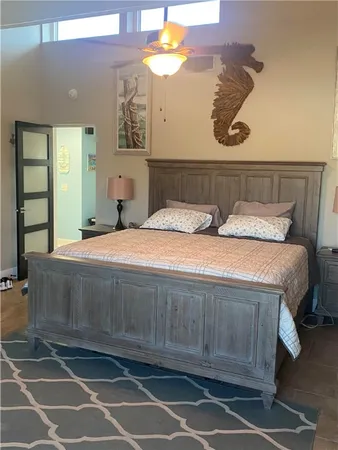 a bedroom with a bed and window