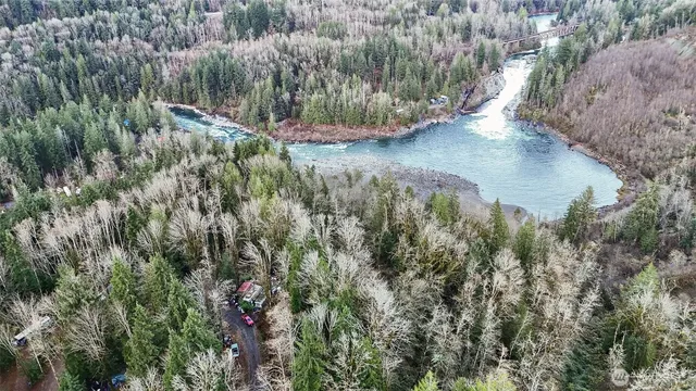 a view of a lake with large trees