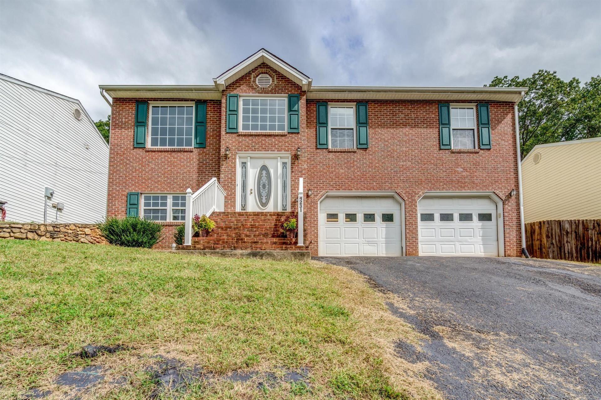 4231 Daugherty Road Salem, VA 24153 - Photo 1 of 23 a front view of a house with a yard and garage