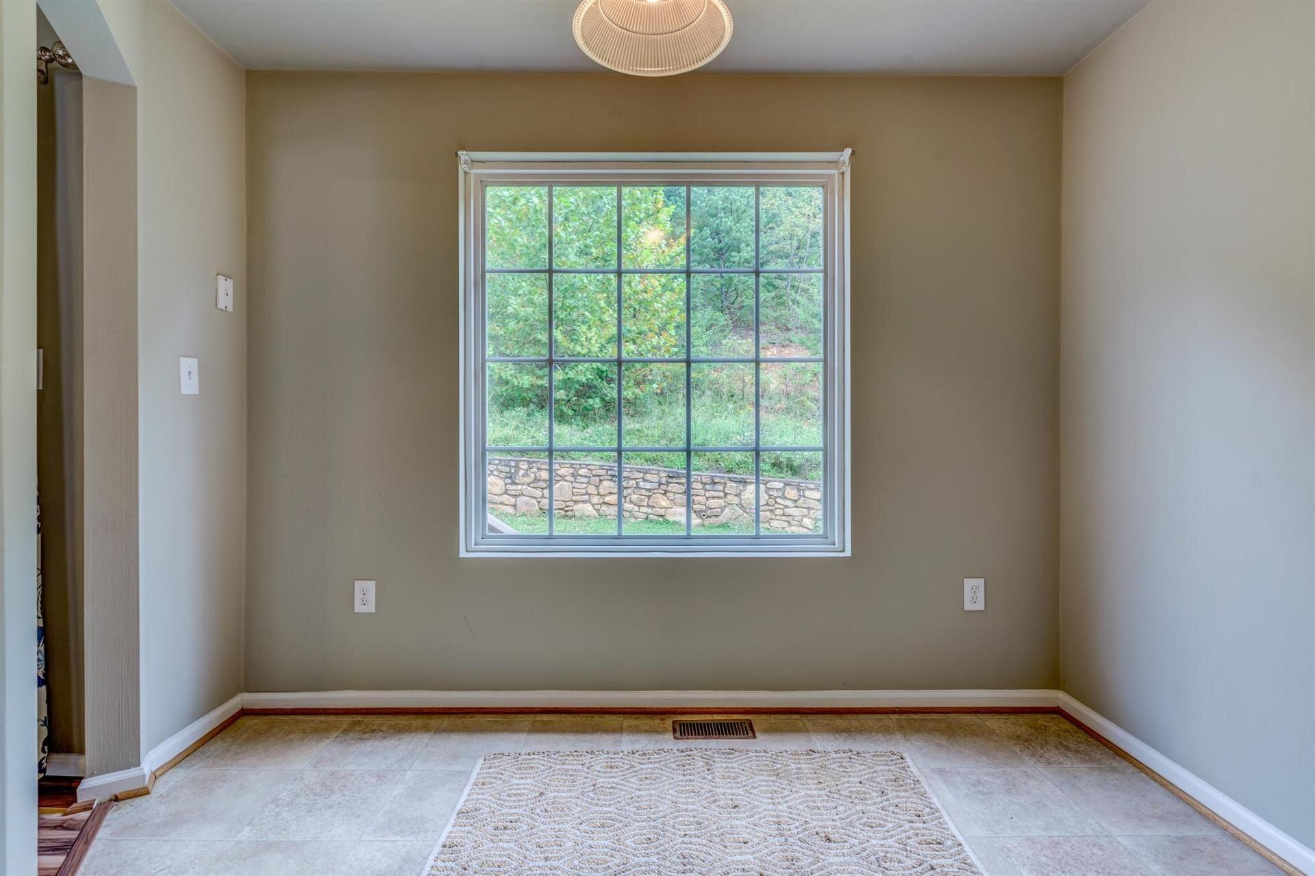 4231 Daugherty Road Salem, VA 24153 - Photo 6 of 23 an empty room with wooden floor and windows
