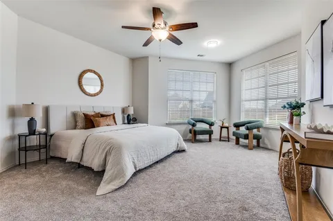 a bedroom with bed and a chandelier