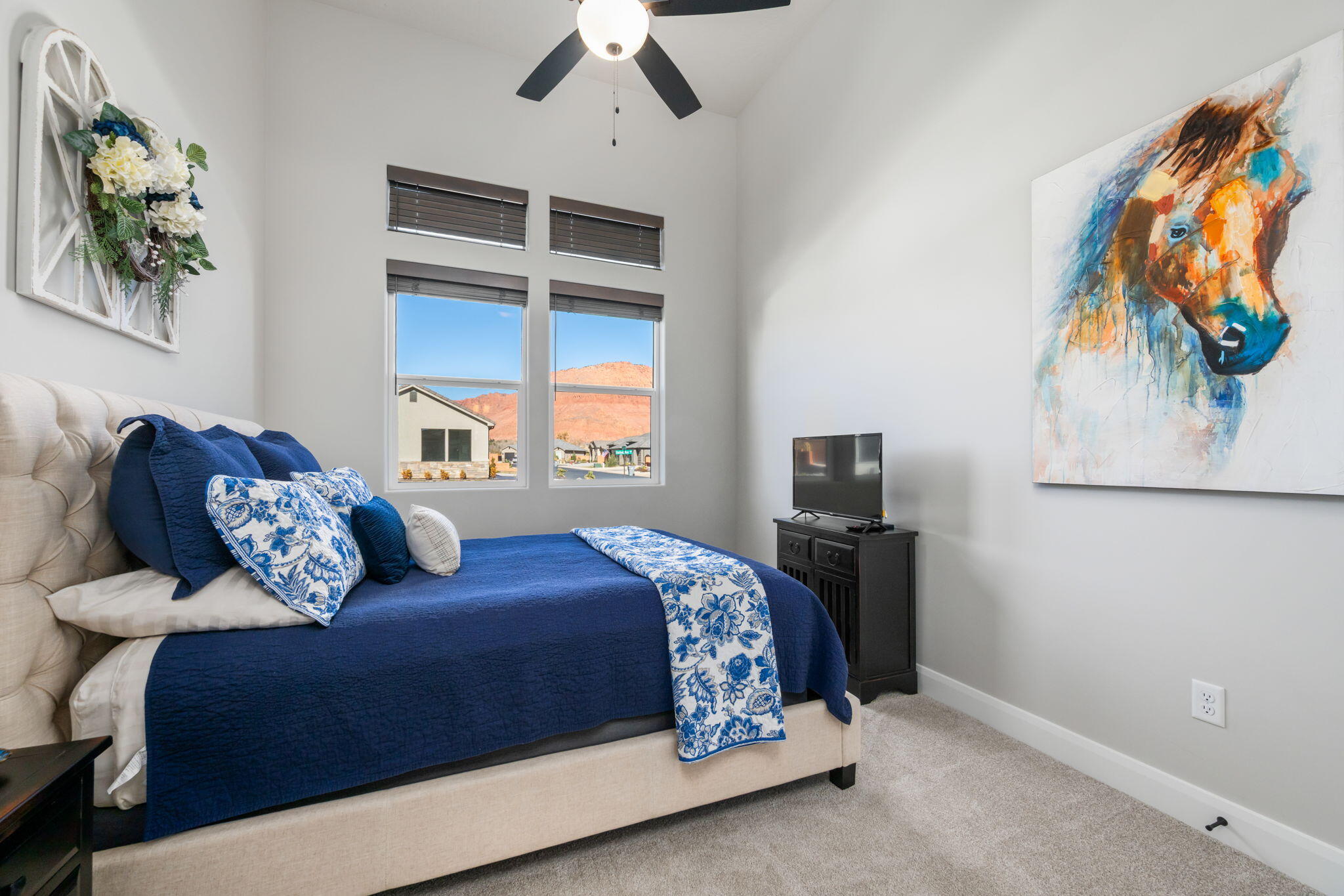 227 United Way Ivins, UT 84738 - Photo 17 of 28 Versatile bedroom ideal for guests, family, or a home office.